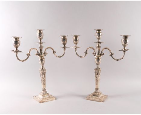 A PAIR OF SILVER THREE LIGHT TABLE CANDELABRAEach with a tapered square section stem, urn form surmount, decorated with penda