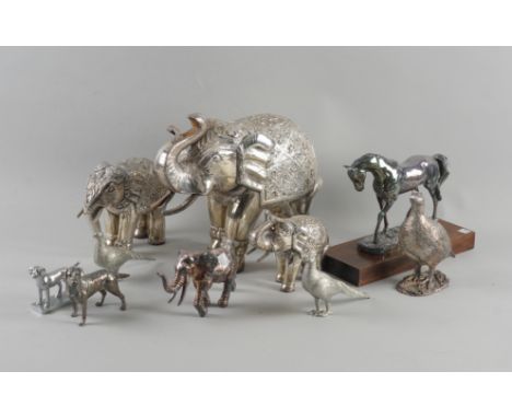 A SILVER MODEL OF A STANDING HORSE AND TEN FURTHER ITEMS (11)The standing horse, Sheffield 2000, detailed Filled, fitted to a