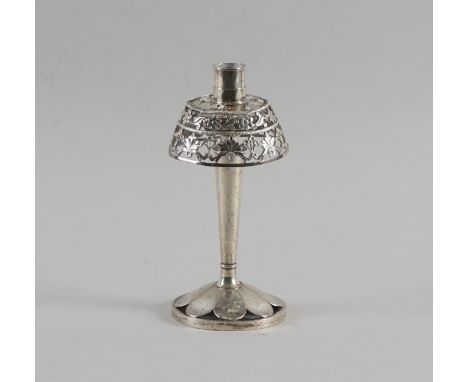 A TABLE CANDLESTICK CONVERTED TO A TABLE LAMPPossibly Peruvian, the circular foot with floral pierced decoration, gross weigh