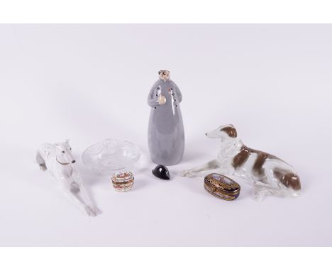 A GROUP OF CONTINENTAL PORCELAIN (7)Late 19th/20th century Comprising; a Rosenthal model of a recumbent borzoi, 28cm length; 