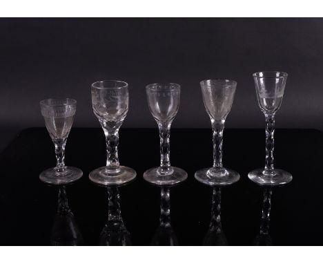 FIVE ENGRAVED FACET STEMMED WINE GLASSES (5)Late 18th century Including one engraved with a figure fishing, one with fruiting