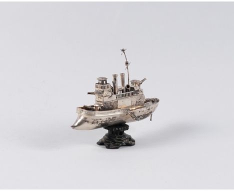 A MODEL OF A GUN BOATProbably Chinese, unmarked, length 16cm, fitted to an associated wooden stand
