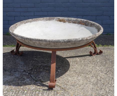 WILLY GUHL; A LARGE FIBRE CEMENT CIRCULAR PLANTEROn wrought iron base, 119cm diameter, 50cm high