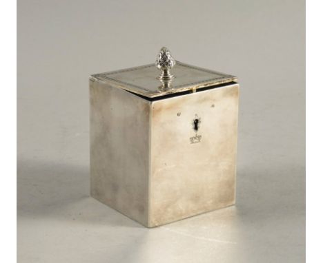 A GEORGE III SILVER TEA CADDYOf rectangular hinge lidded form, with a pine cone finial and lock and key, height including fin