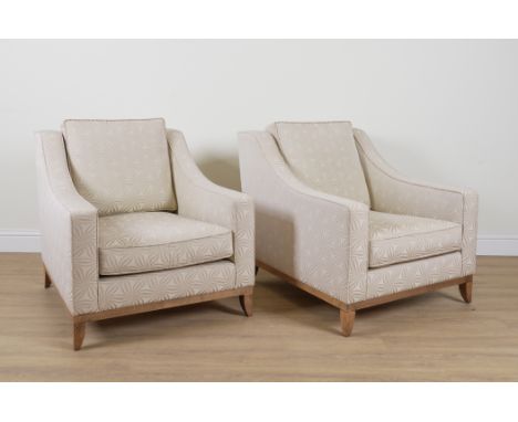 THE SOFA & CHAIR COMPANY; A PAIR OF WHITE UPHOLSTERED LOW ARMCHAIRS (2)83cm wide; 86cm highBoth in good overall condition, on