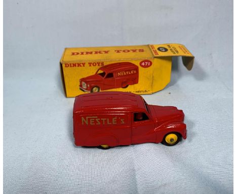 A Dinky Toys originally boxed diecast vehicle 471 Austin Van "Nestle's" (box worn) 