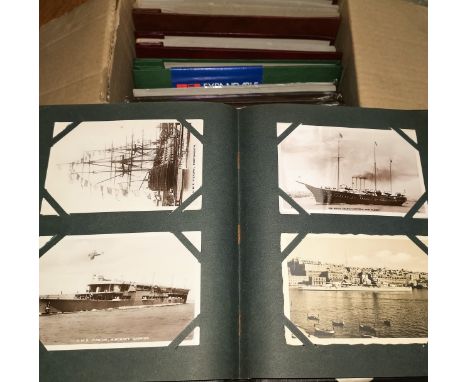A selection of vintage postcards; 5 albums of modern postcards 