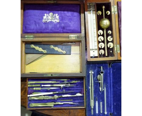 A mahogany cased  Sikes Hydrometer with fitted weights etc: a rosewood cased set of drawing instruments: a similar set 