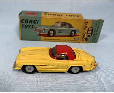 An originally boxed Corgi Toys diecast vehicle 304 Mercesdes-Benz 300SL, hardtop Roadster in cream and red with original club