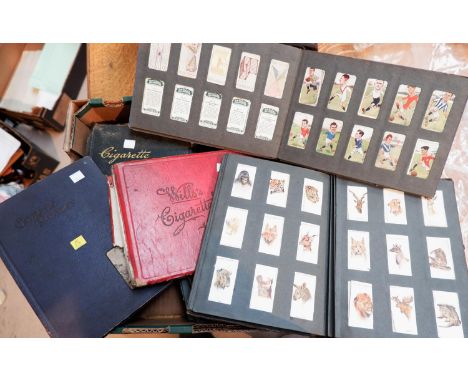 A collection of vintage cigarette cards in 7 albums 