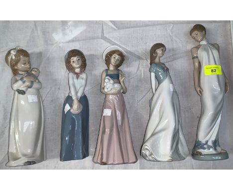 A NAO porcelain figure of a young woman in evening dress and 4 similar figures 