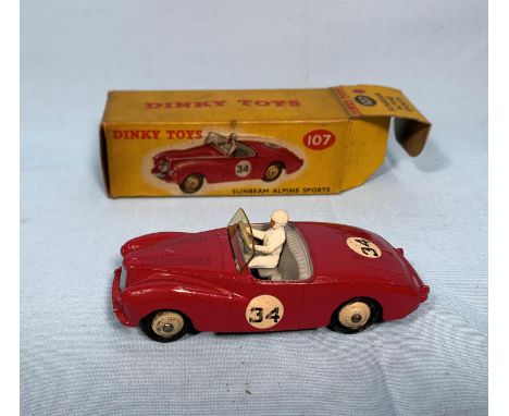 A Dinky Toys originally boxed diecast vehicle 107 Sunbeam Alpine Sports (boxed worn) 