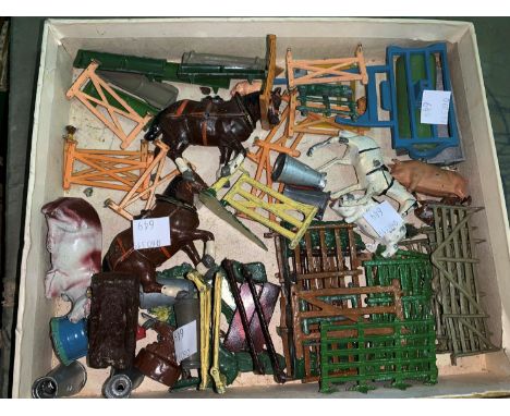 A vintage farm with various buildings and a quantity of painted lead figures 