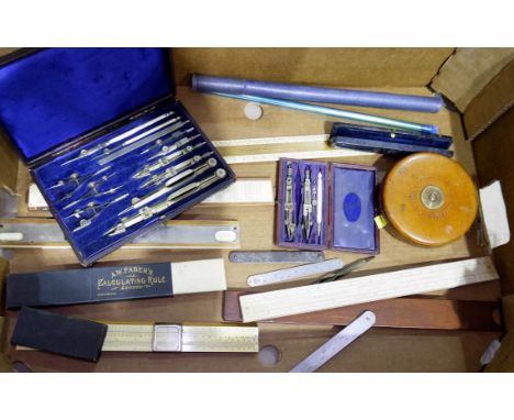 2 cased sets of vintage drawing instruments, rulers and slide rules, thermometer etc. 