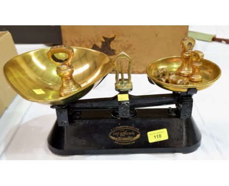 A pair of vintage shop scales with brass pans; a set of 7 graduated brass weights plus a copper bed pan 