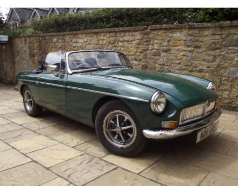 A 1977 MG B roadster, registration number NDR 88S, Brooklands green. This MG B was originally supplied by Wadham Stringer, Ta