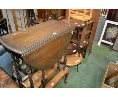 An oak barley twist drop leaf table; an oak occasional table with bobbin turned supports; an oak nest of tables; a chair; etc