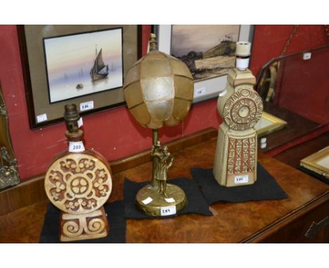 A Cornish Cairn Pottery earthenware table lamp, green and brown motte glaze; another earthenware table lamp; a brass table la