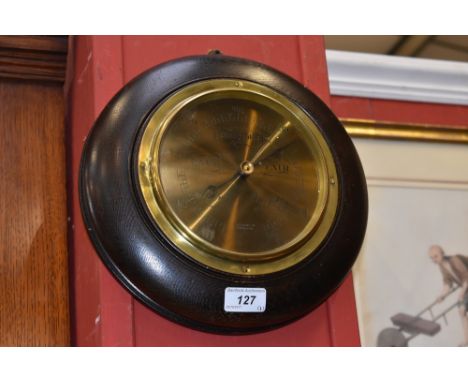 A Finnegans Ltd. Manchester aneroid barometer, brass dial.