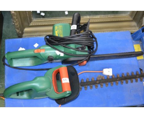 A Black and Decker electric hedge trimmer model GT351; a Black and Decker electric chainsaw model GK1630T (2)
