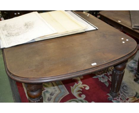 A Victorian mahogany windout dining table, rounded ends, tapering lobed legs, ceramic casters. 75cm high x 120cm wide x 138cm