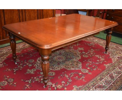 A Victorian mahogany extending dining table, moulded top, loped inverted baluster legs, ceramic casters, circa 1860 (one leaf