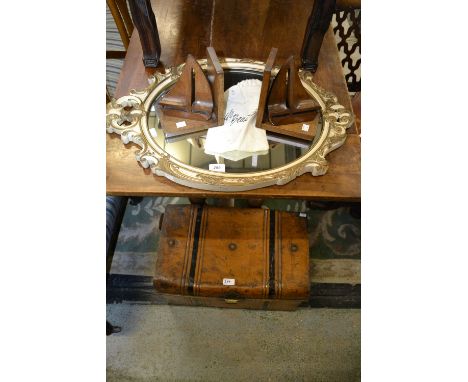 A tin trunk from Bennetts Derby; a pair of treen sailing boat book ends; a wall mirror
