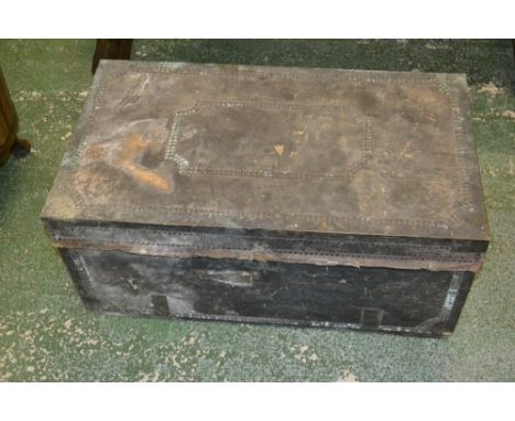 A leather bound, brass studded  trunk 