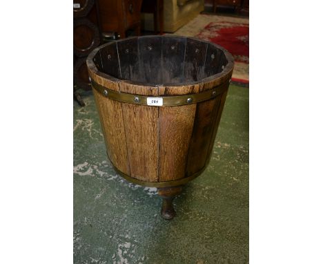 A 20th century oak coopered barrel stick stand