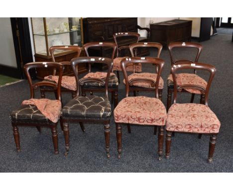 A set of nine Victorian mahogany balloon back dining chairs, horizontal splats, stuffed overseat, turned forelegs, ceramic ca