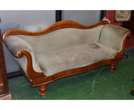 A Victorian mahogany sofa, shaped back, scrolling padded arms, padded seat, turned legs, circa 1880.