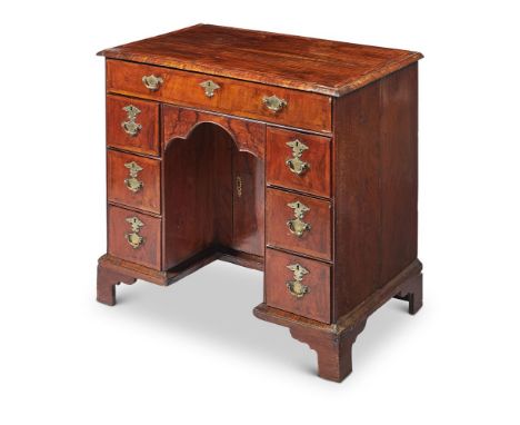 A GEORGE II WALNUT KNEEHOLE DESK CIRCA 1740With bracket feet85cm wide; together with a George II mahogany toilet mirror circa