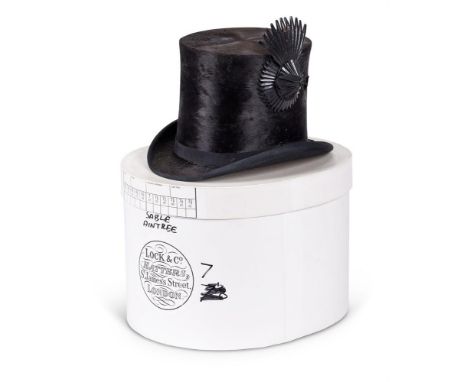 A HENRY HEATH COACHMAN'S BLACK SILK TOP HAT 19TH CENTURY With pressed leather aigrette to one side, no size, and a contempora