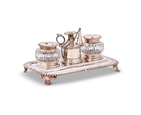 A GEORGE IV SILVER ROUNDED RECTANGULAR INKSTAND BY EDWARD, EDWARD JUNIOR, JOHN & WILLIAM BARNARDLONDON 1829The central tapers