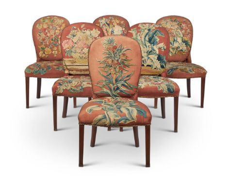 A SET OF SIX GEORGE III MAHOGANY AND UPHOLSTERED SIDE CHAIRSCIRCA 1780Each oval padded back and serpentine seat worked in 18t