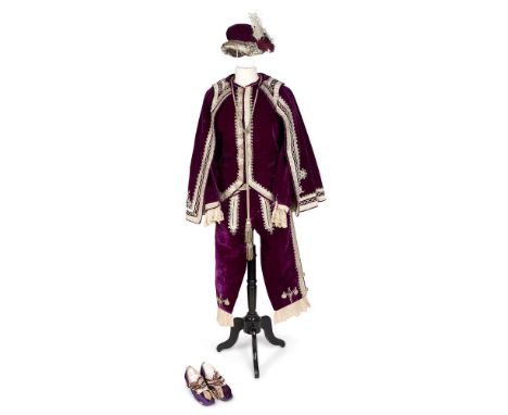 A PURPLE SILK VELVET COSTUME IN MEDIEVAL STYLE, TAILOR MADEComprising a fitted jacket, a pair of breeches with button fly clo