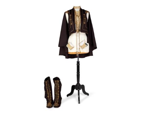 A WOOL FLANNEL BIB/BODICE FRONT19TH CENTURYWith finely detailed arabesque scrolling in gold couch work, with faux closure fro