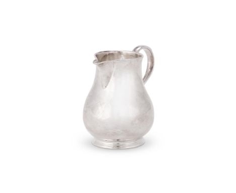 AN EARLY GEORGE II SILVER BALUSTER CREAM JUG BY GEORGE WICKESLONDON 1728With a sparrow beak spout, a tongue-capped S-scroll h