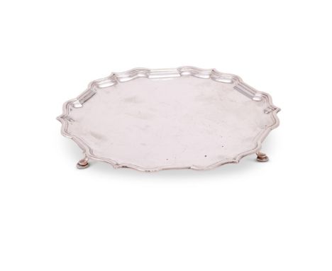 A SILVER SHAPED CIRCULAR SALVER BY GARRARD & CO. LTDSHEFFIELD 1965Stamped for Garrard & Co. as retailers, with a raised mould