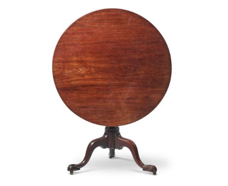 A GEORGE III MAHOGANY OCCASIONAL OR SUPPER TABLECIRCA 1780The circular top above a fluted stem, wrythen vase and tripod base7