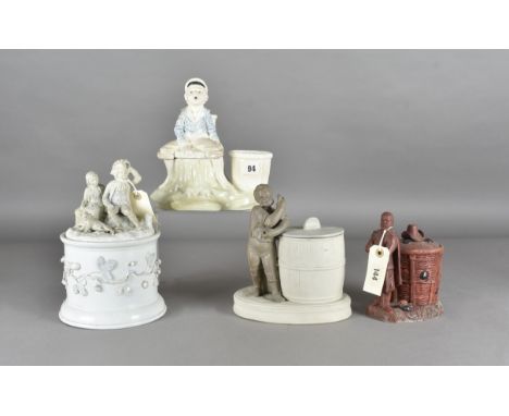 A Sarreguemines bisque pottery tobacco jar and cover, man with bottle and pipe in hand standing by a barrel, impressed mark a