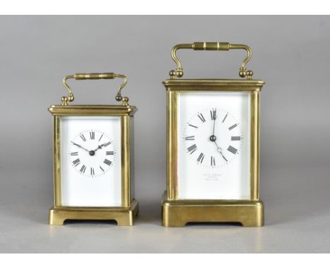A brass carriage clock by R & W Sorley Glasgow, with French movement, white enamel face, Roman numerals, blued steel hands, a