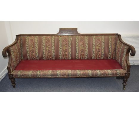 A near pair William IV mahogany framed sofas, with reeded scroll arms, on turned supports and brass and ceramic castors,  one