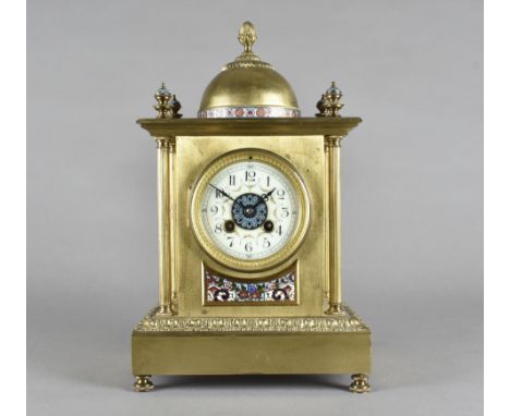 A 19th Century brass architectural shaped mantel clock, with domed top, four column support, French drum movement, white enam