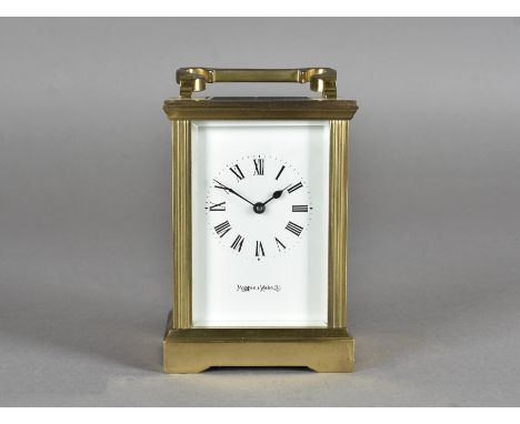 A Mappin and Webb brass carriage timepiece, with white enamel dial and Roman numerals, 13 cm high 