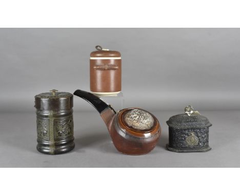 A brown glazed pottery and leather covered pipe patter tobacco jar, a patent leather bound octagonal tobacco box, the front o