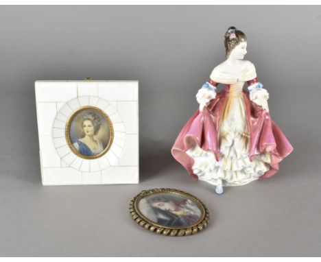 A painted ivory oval miniature of the Madonna, 8.3 cm high, together with a miniature oval portrait of a young woman, 6.1 cm 