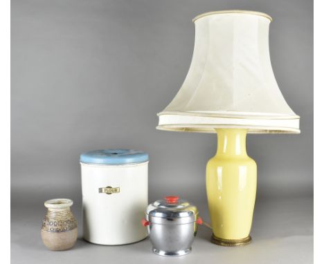 A pottery yellow glazed table lamp, and shade, a chromed thermos ice bucket, a 50s flour pot and cover 