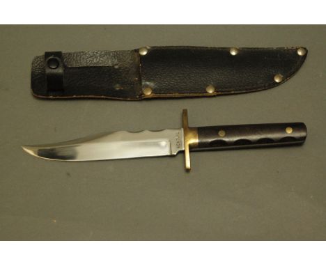 Bowie knife, blade stamped Venture, Sheffield, England, brass crossguard, hardwood scales and sheath.  Blade 6", overall 26 c