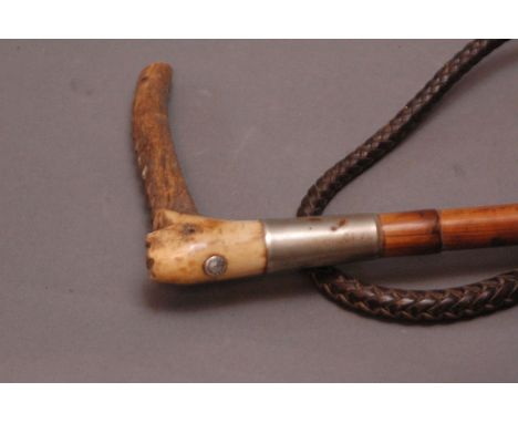 Swaine & Co. London riding whip with antler handle, Swaine button, metal collar, bamboo shaft, thong and whip section.  Lengt